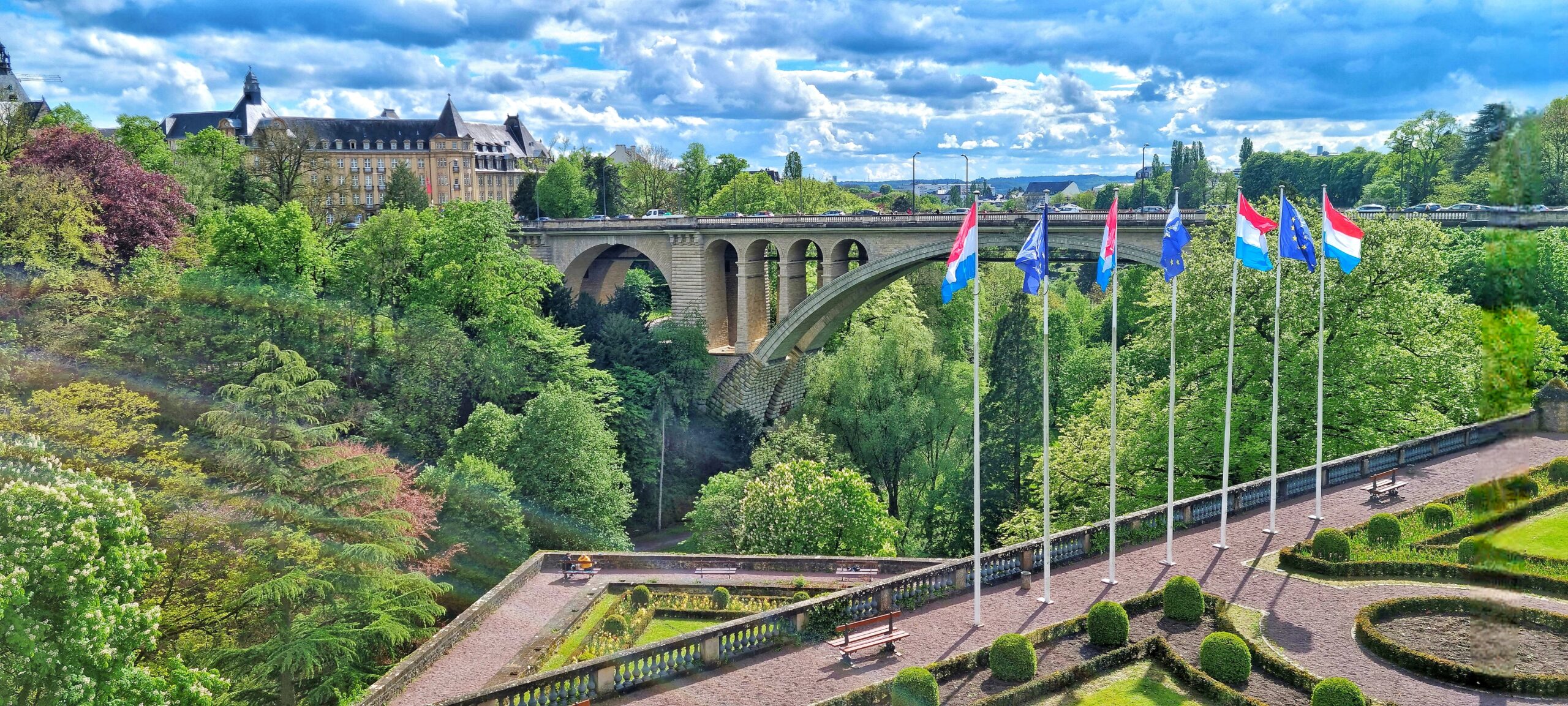 landscape with a bridge a country flags